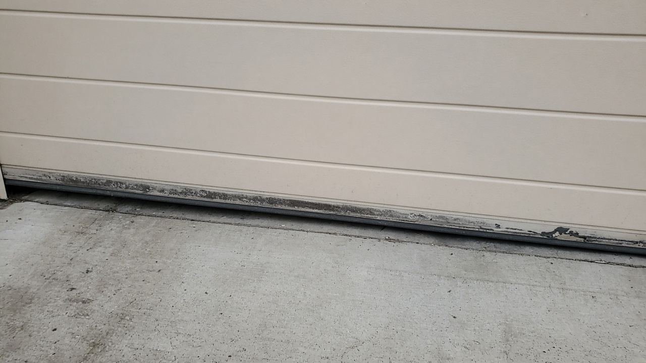Worn rubber sweep along the bottom of a garage door