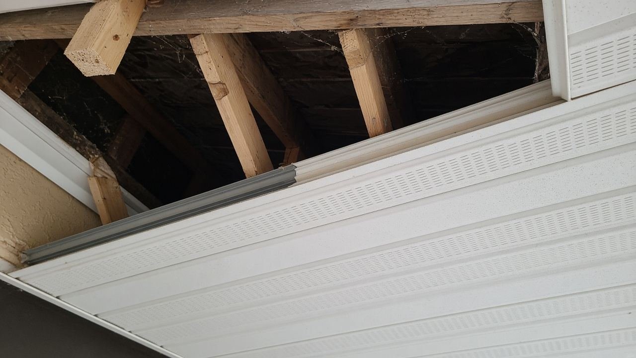 An open soffit bay, seen from a ladder
